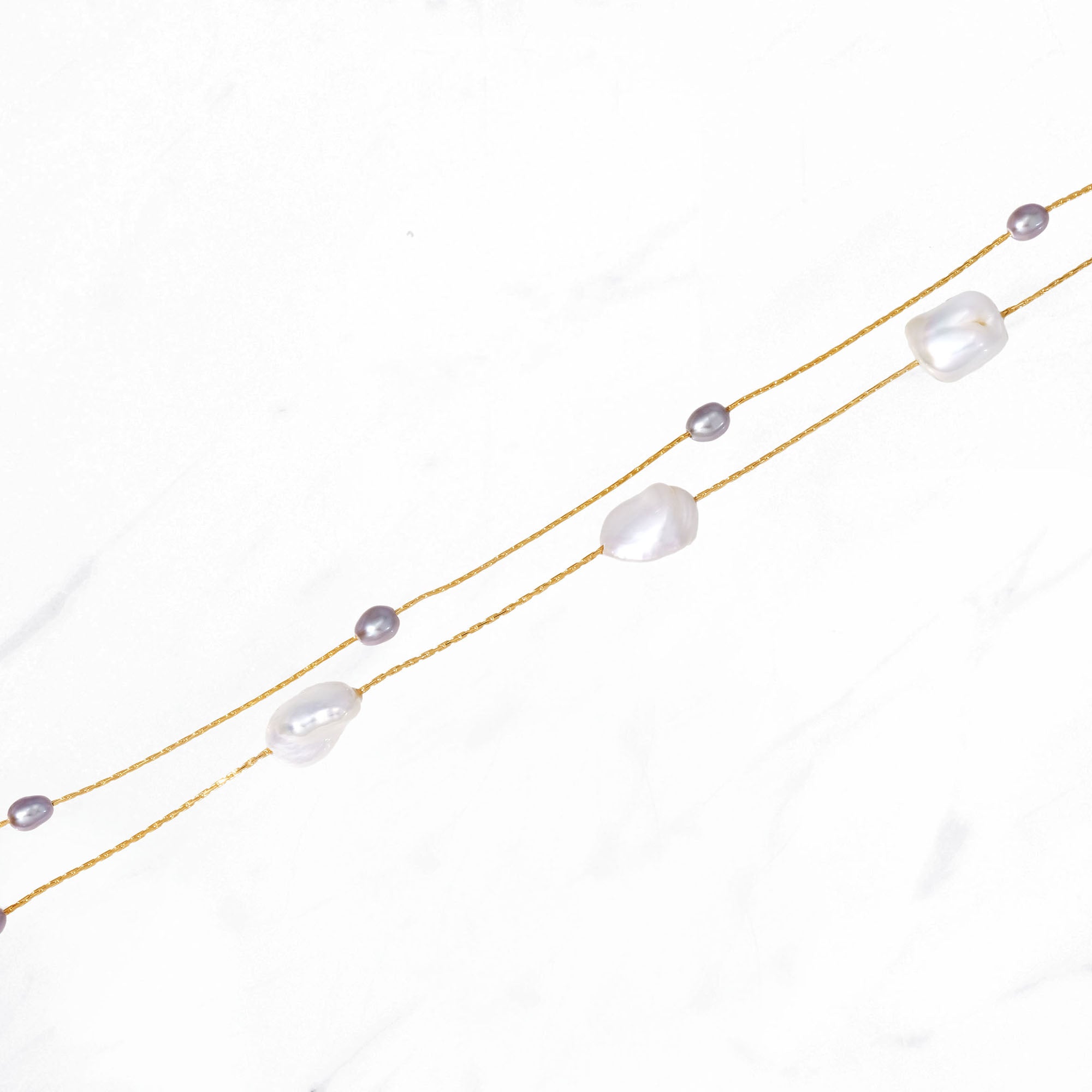 Decade Long Pearl Necklace